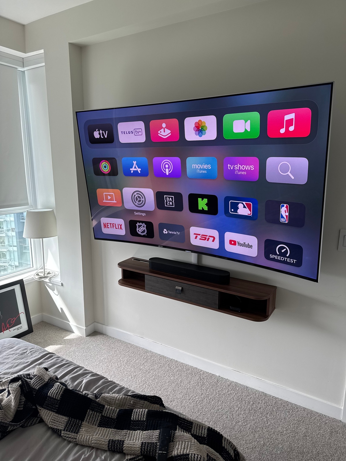 Wall-mounted television on a ceramic tile fireplace feature wall